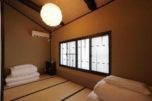 Вилла Kohaku An Machiya House Киото Номер фото